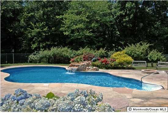 49 Phalanx Road Colts Neck, NJ 07722 - Photo 3 of 3 a view of a backyard