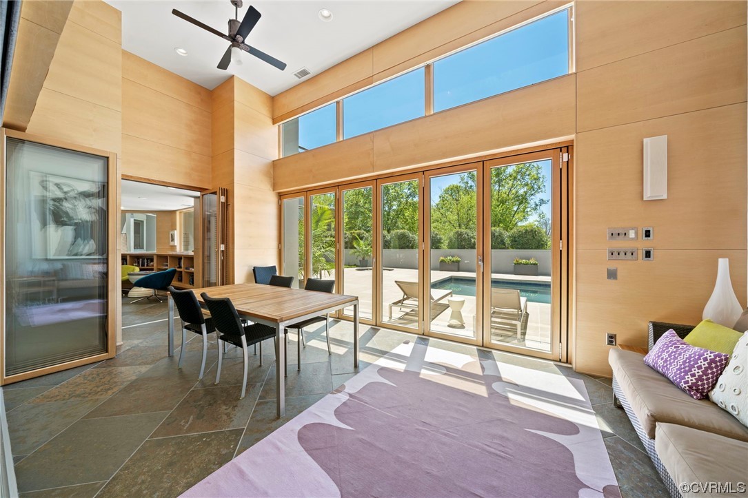 640 Walsing Drive Henrico, VA 23229 - Photo 16 of 37 a dining room with furniture and a floor to ceiling window