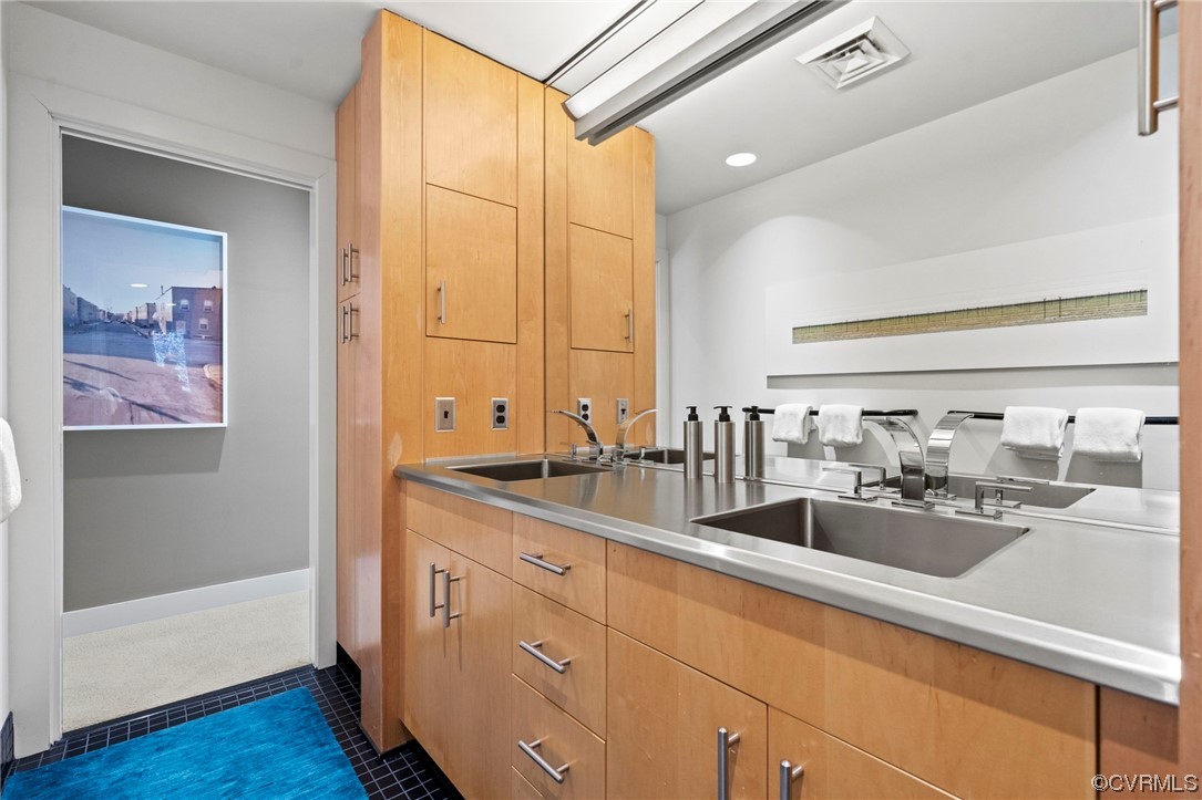 640 Walsing Drive Henrico, VA 23229 - Photo 21 of 37 a large bathroom with double vanity sink a mirror and shower