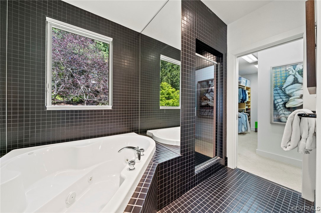 640 Walsing Drive Henrico, VA 23229 - Photo 22 of 37 a bathroom with a bathtub and a shower