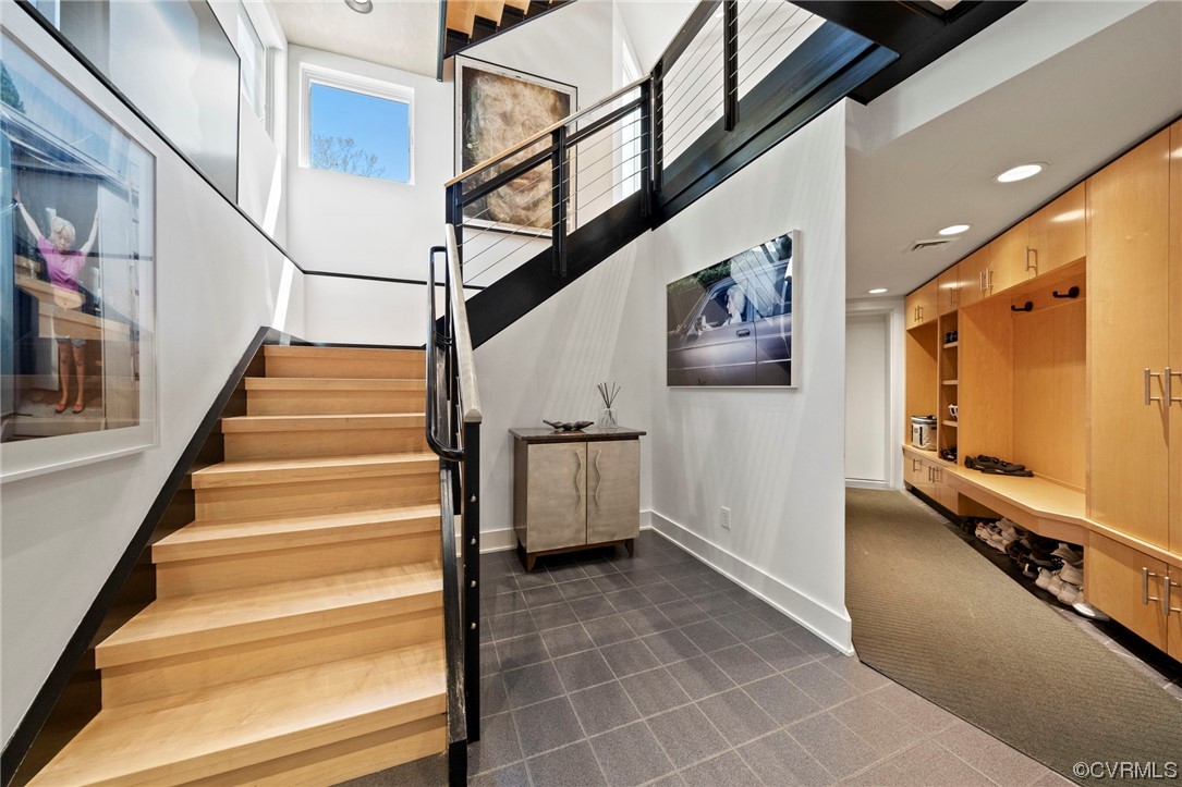 640 Walsing Drive Henrico, VA 23229 - Photo 31 of 37 a view of staircase with lots of frames on wall and a window
