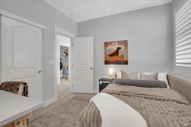 a bedroom with a bed and a couch