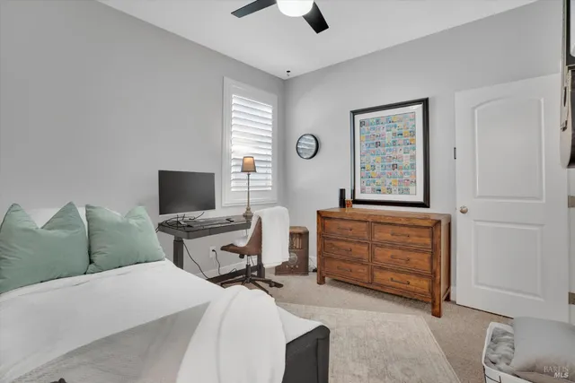 a bedroom with a bed and a television