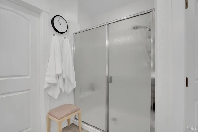 a bathroom with a shower and a toilet