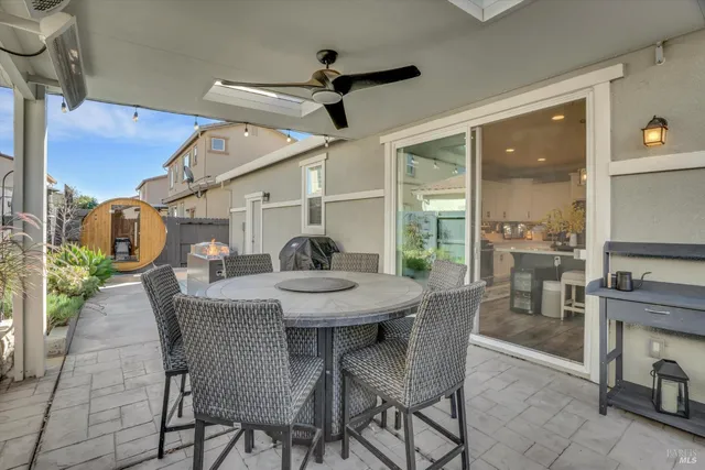a dining room with furniture and window
