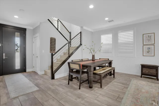 a view of a livingroom with furniture and stairs