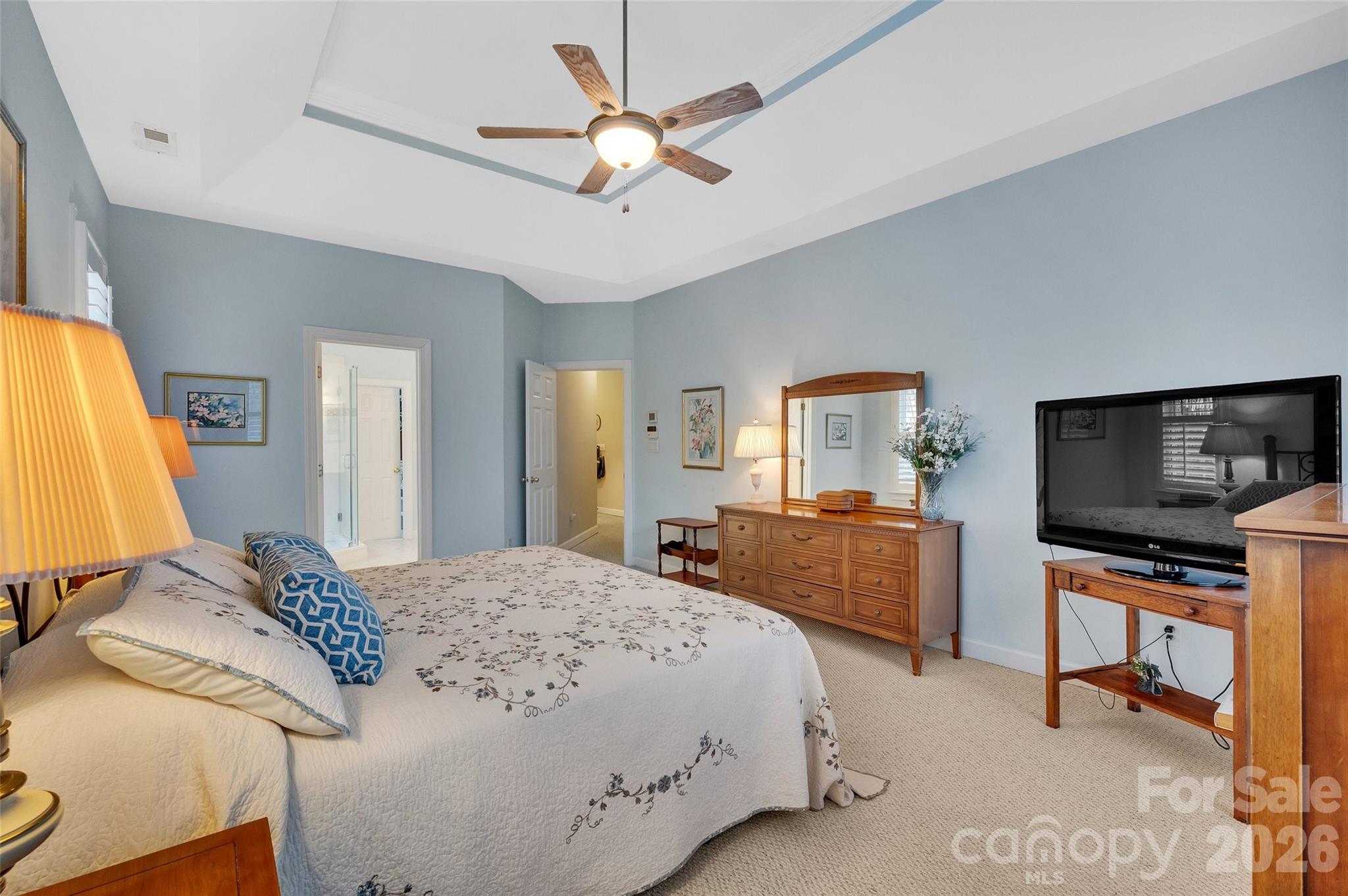 3001 River Bend Drive Tega Cay, SC 29708 - Photo 18 of 36 a bedroom with a bed and a flat screen tv