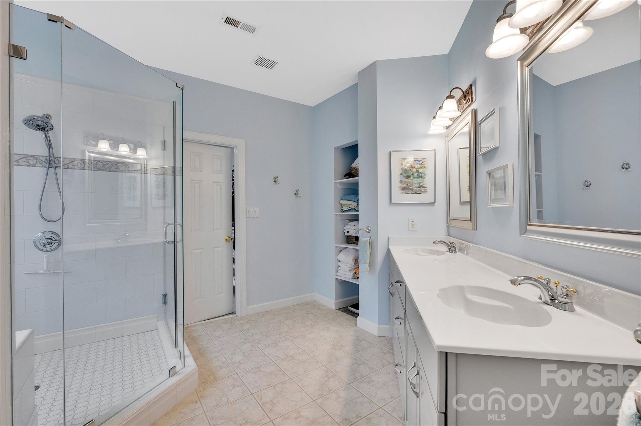 3001 River Bend Drive Tega Cay, SC 29708 - Photo 19 of 36 a bathroom with a sink tub shower and a mirror
