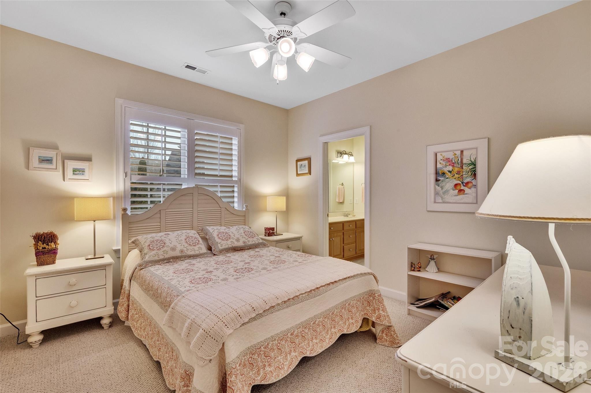 3001 River Bend Drive Tega Cay, SC 29708 - Photo 22 of 36 a bedroom with a bed and a chandelier