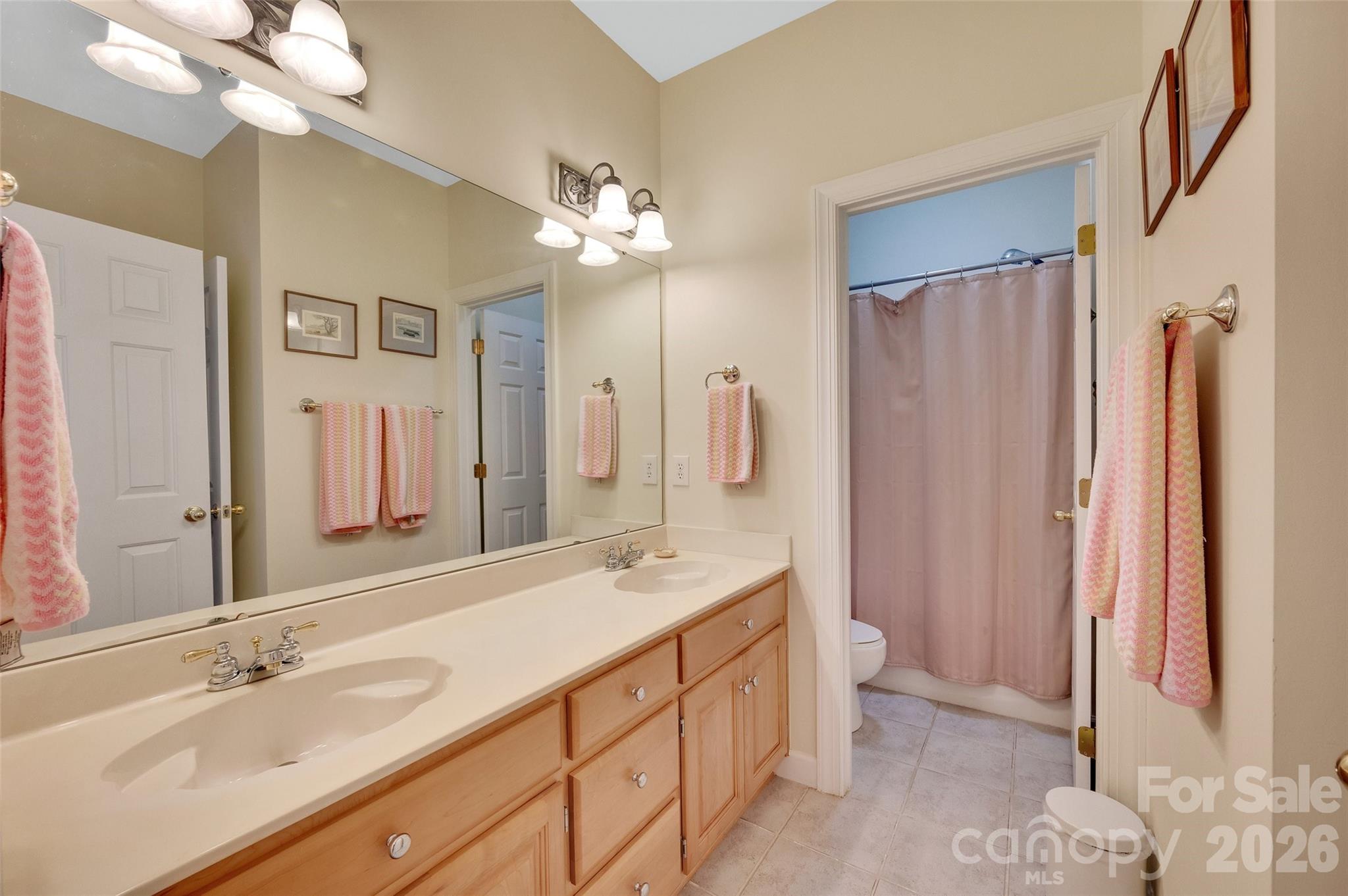 3001 River Bend Drive Tega Cay, SC 29708 - Photo 25 of 36 a spacious bathroom with a double vanity sink mirror and double