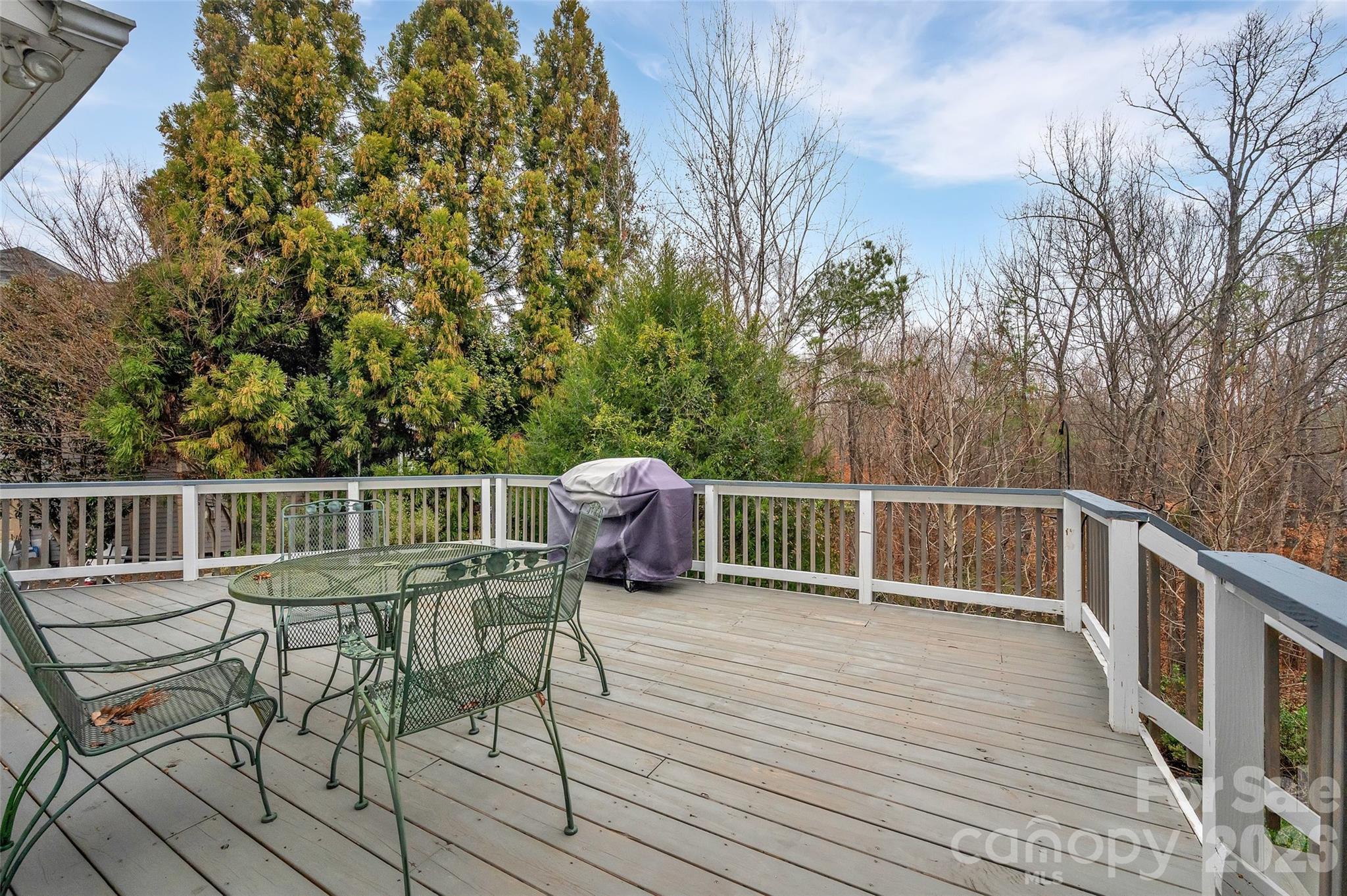 3001 River Bend Drive Tega Cay, SC 29708 - Photo 27 of 36 a view of a chair and table on the wooden floor