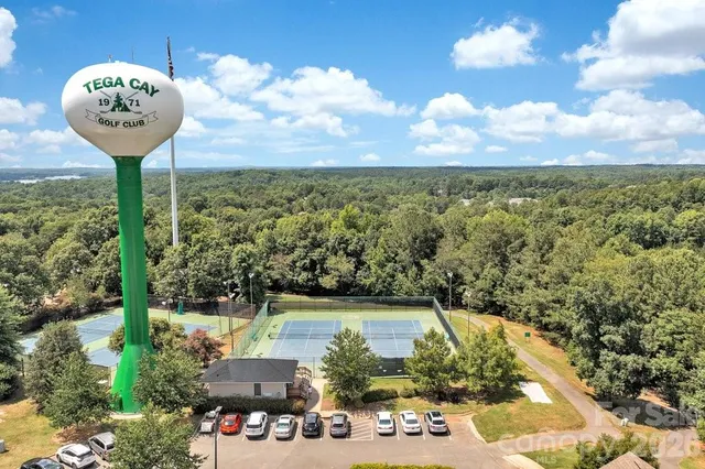 a view of a swimming pool with a yard