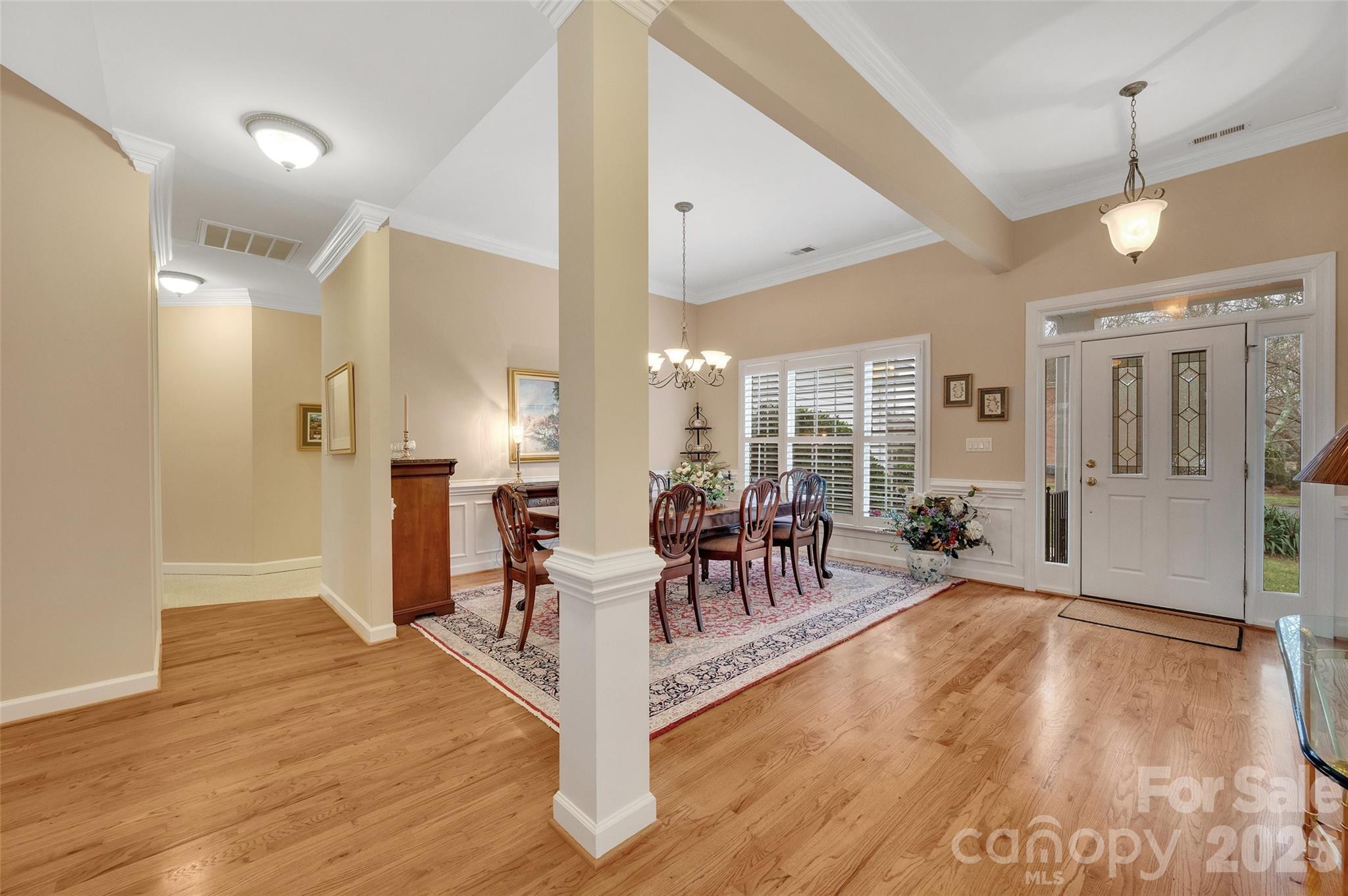 3001 River Bend Drive Tega Cay, SC 29708 - Photo 4 of 36 a view of a a dining room with furniture window and wooden floor