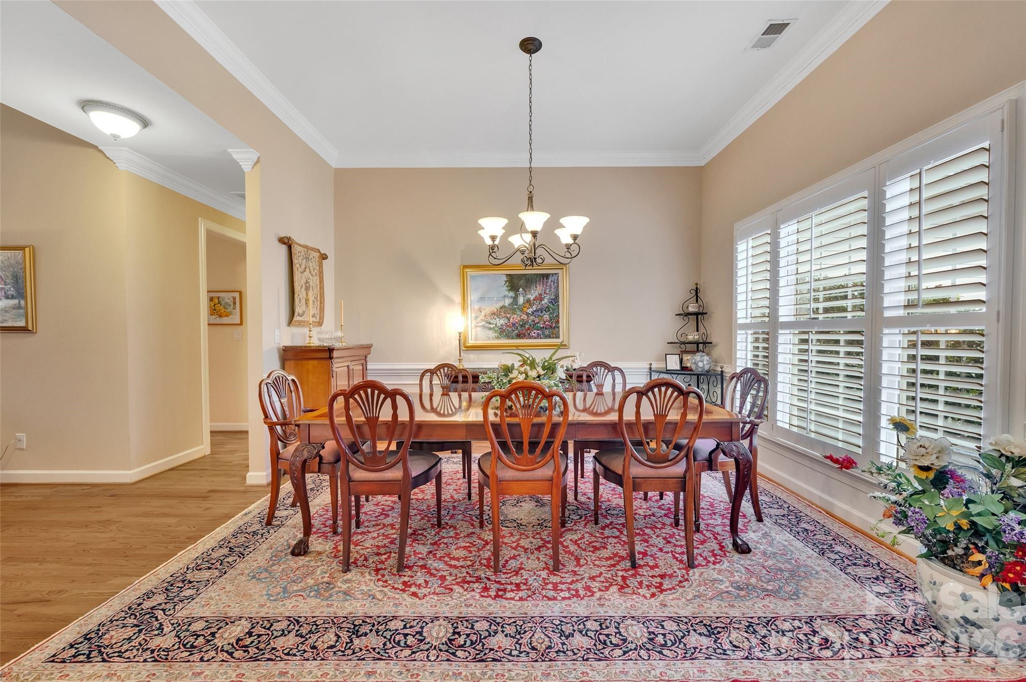 3001 River Bend Drive Tega Cay, SC 29708 - Photo 6 of 36 a dining room with furniture a rug and a chandelier