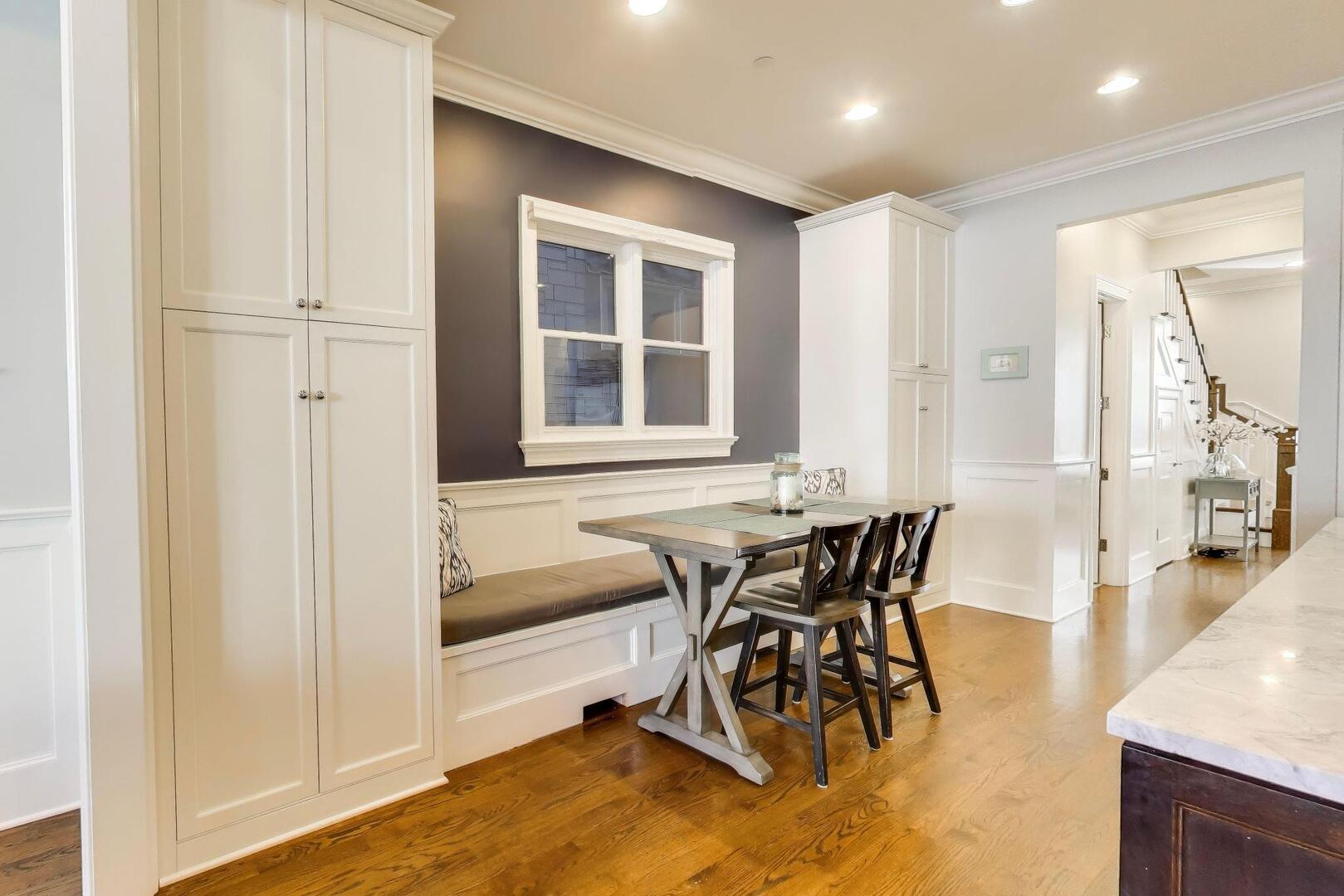 1428 West George Street Chicago, IL 60657 - Photo 11 of 66 a dining room with furniture and a window