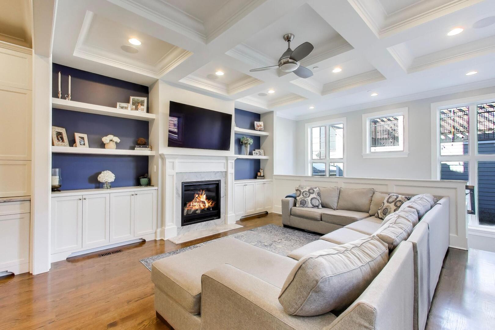 1428 West George Street Chicago, IL 60657 - Photo 13 of 66 a living room with furniture a fireplace and a flat screen tv