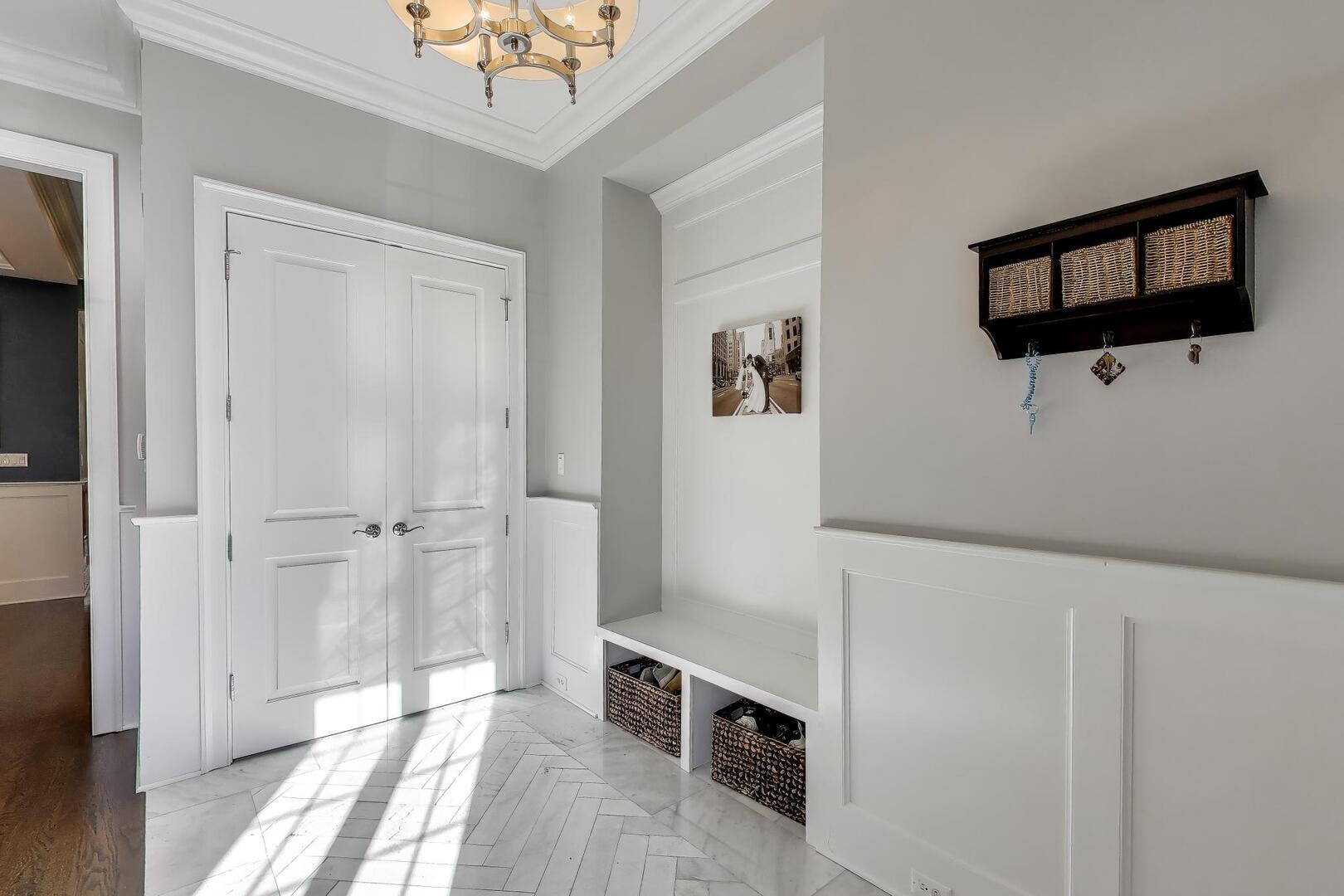 1428 West George Street Chicago, IL 60657 - Photo 17 of 66 a view of a livingroom with an empty space and a hallway