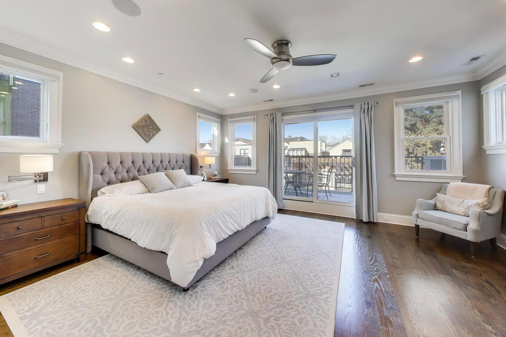 1428 West George Street Chicago, IL 60657 - Photo 19 of 66 a spacious bedroom with a large bed and a couch