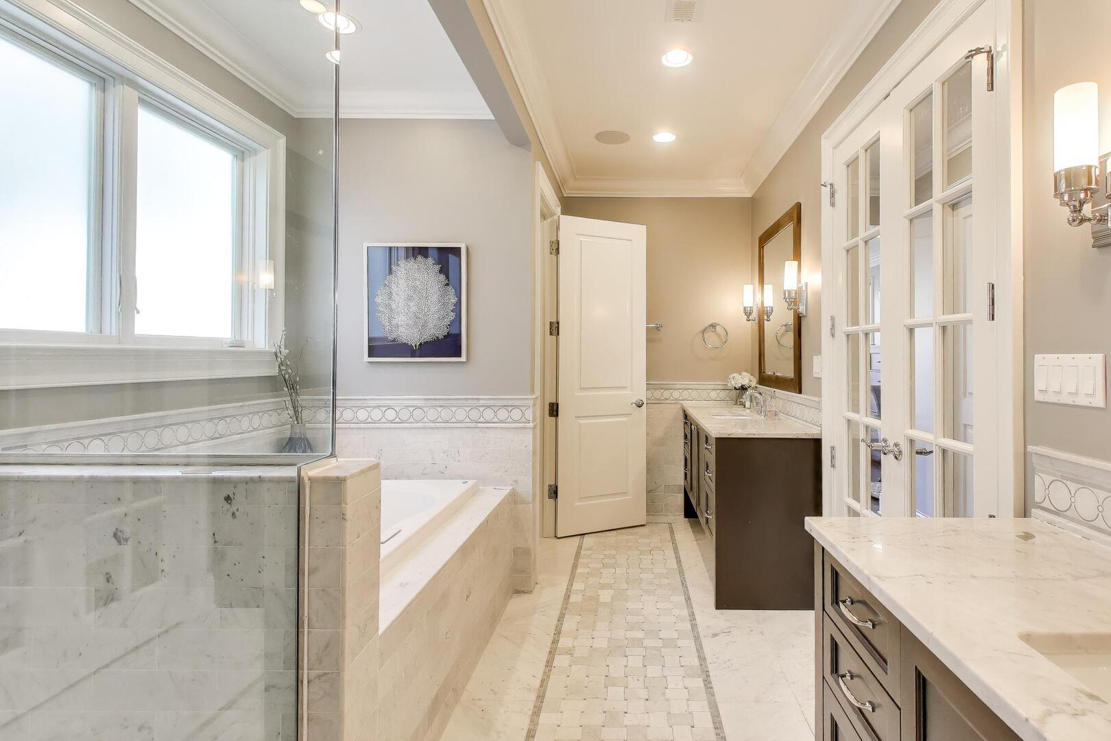 1428 West George Street Chicago, IL 60657 - Photo 23 of 66 a bathroom with a tub sink and mirror