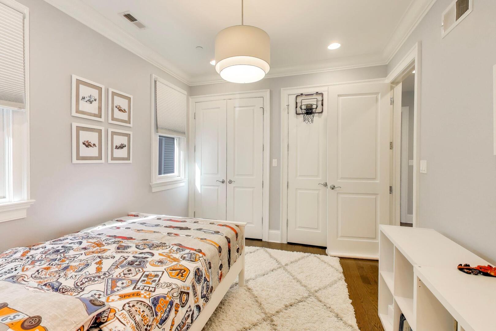 1428 West George Street Chicago, IL 60657 - Photo 26 of 66 a bedroom with a bed and a chandelier