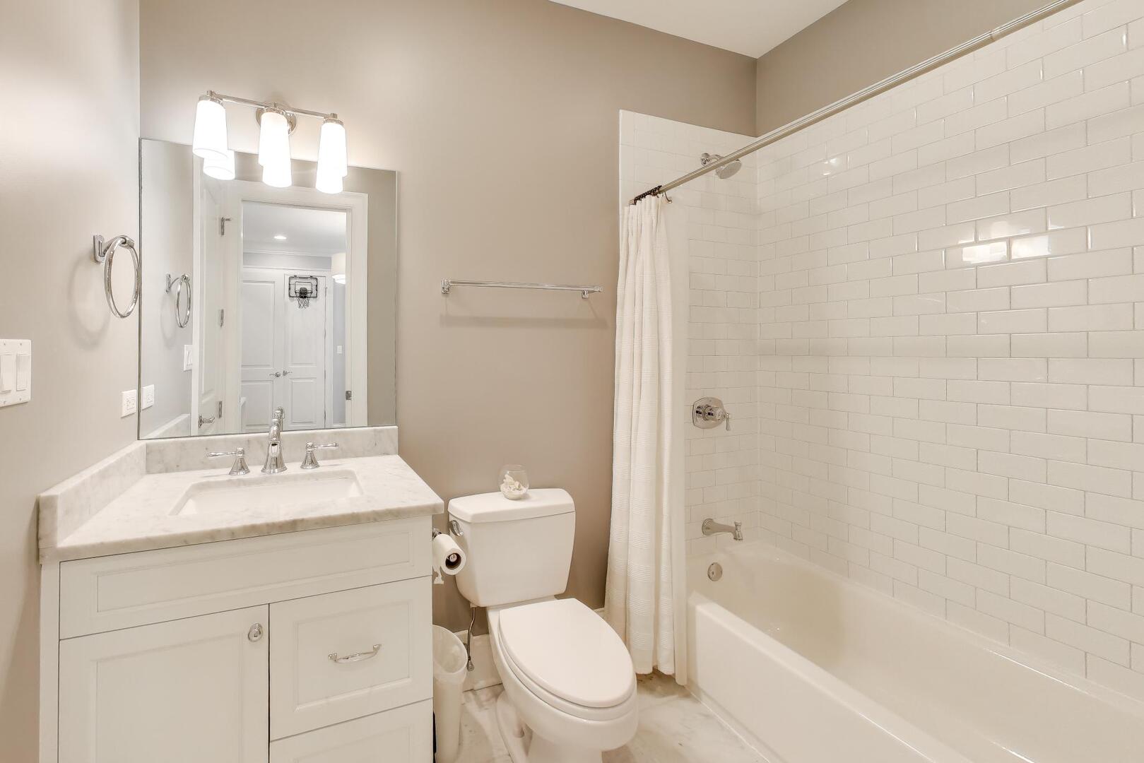 1428 West George Street Chicago, IL 60657 - Photo 27 of 66 a bathroom with a sink a toilet and shower