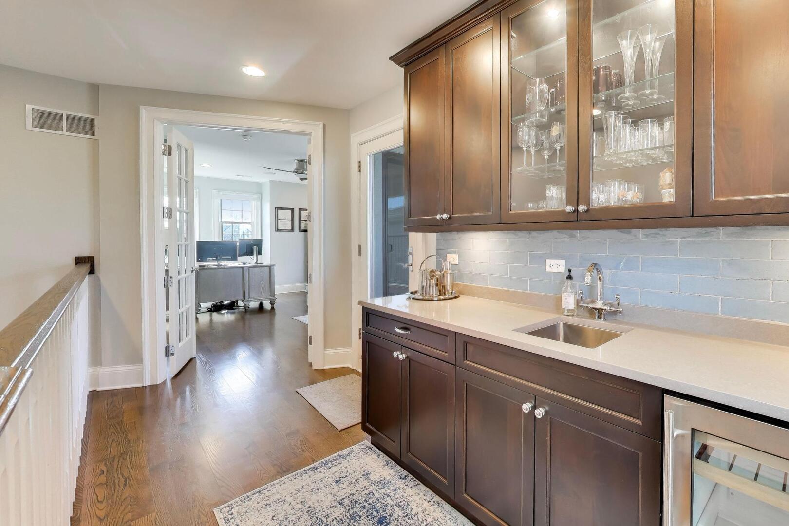 1428 West George Street Chicago, IL 60657 - Photo 34 of 66 a kitchen with a sink and cabinets