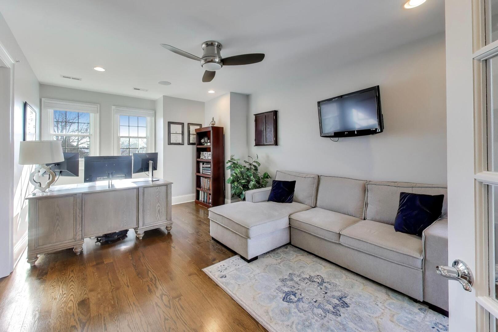 1428 West George Street Chicago, IL 60657 - Photo 35 of 66 a living room with furniture and a flat screen tv