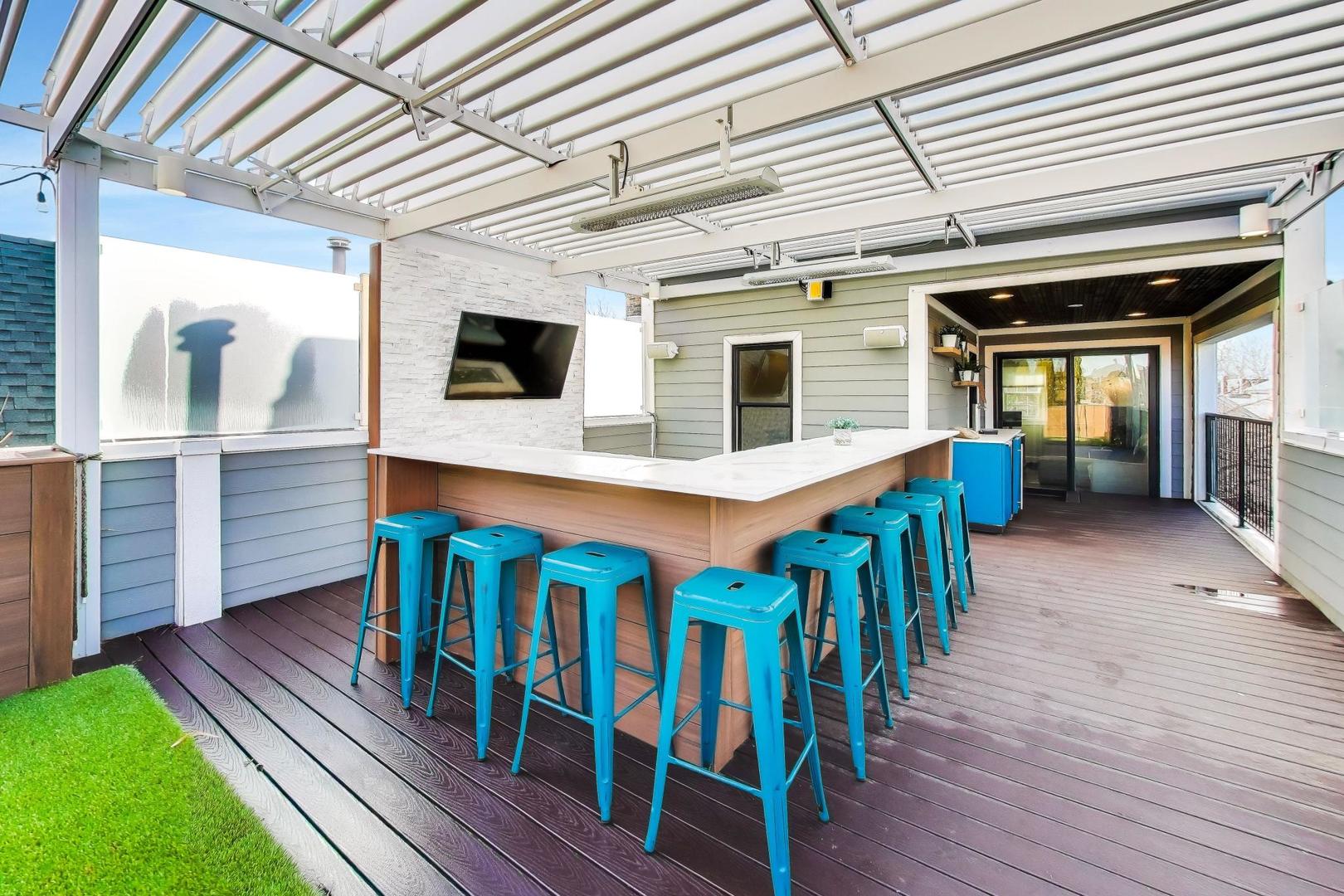 1428 West George Street Chicago, IL 60657 - Photo 39 of 75 a view of a deck with wooden floor and furniture