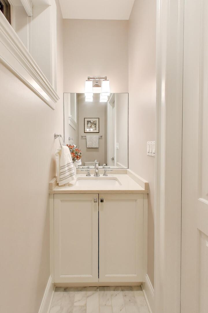 1428 West George Street Chicago, IL 60657 - Photo 48 of 66 a bathroom with a sink and a mirror
