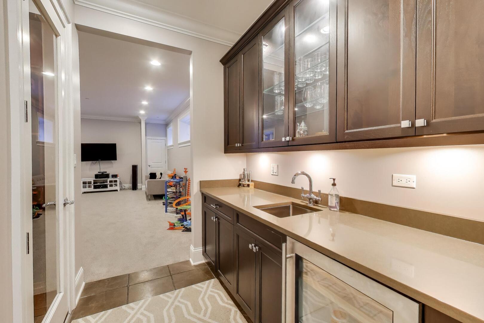 1428 West George Street Chicago, IL 60657 - Photo 50 of 75 a kitchen with a sink and cabinets