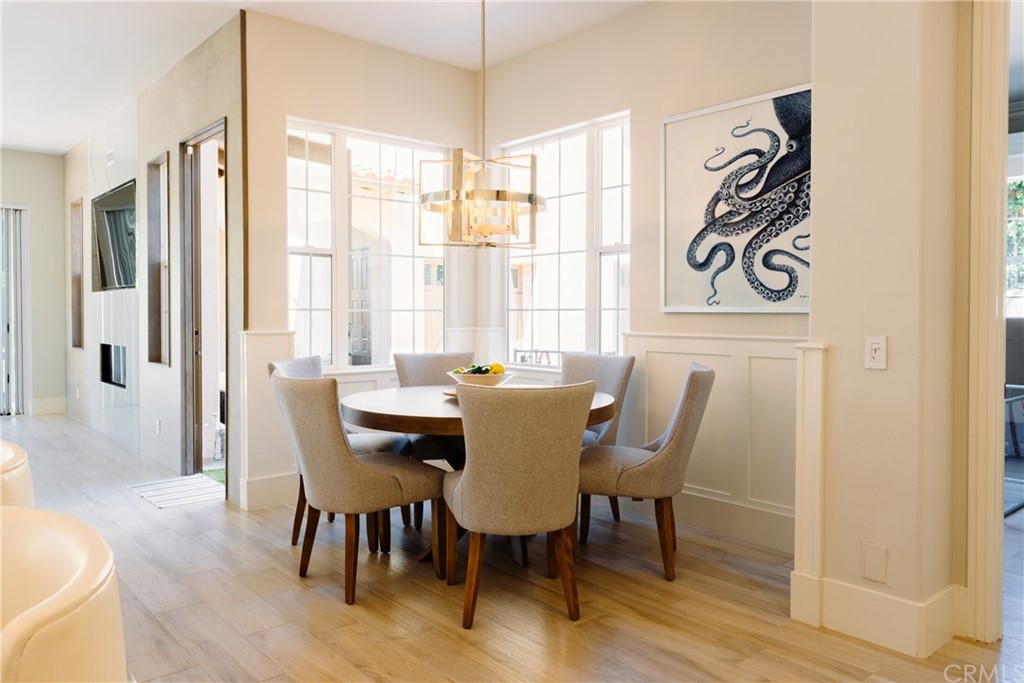 26 Seabluff Newport Beach, CA 92660 - Photo 15 of 59 a view of a a dining room with furniture window and wooden floor