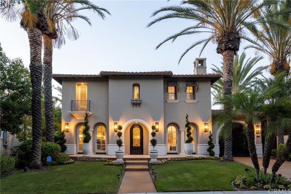 26 Seabluff Newport Beach, CA 92660 - Photo 2 of 59 a front view of multiple houses with yard
