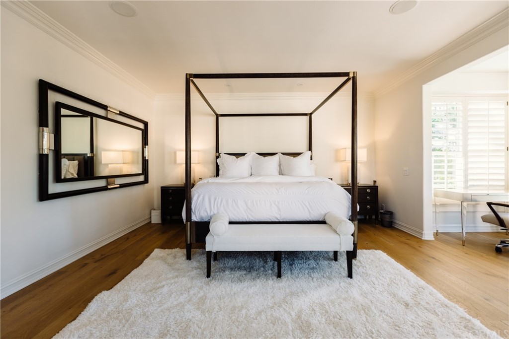 26 Seabluff Newport Beach, CA 92660 - Photo 25 of 59 a bedroom with a bed and wooden floor