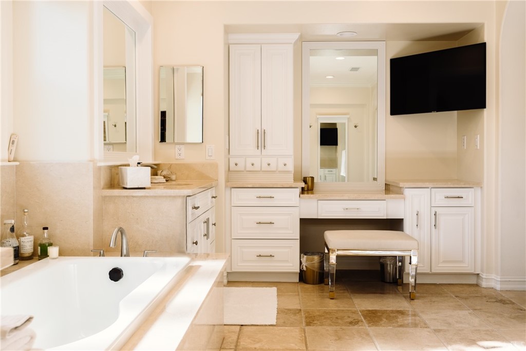 26 Seabluff Newport Beach, CA 92660 - Photo 30 of 59 a spacious bathroom with a double vanity sink a mirror and a bathtub