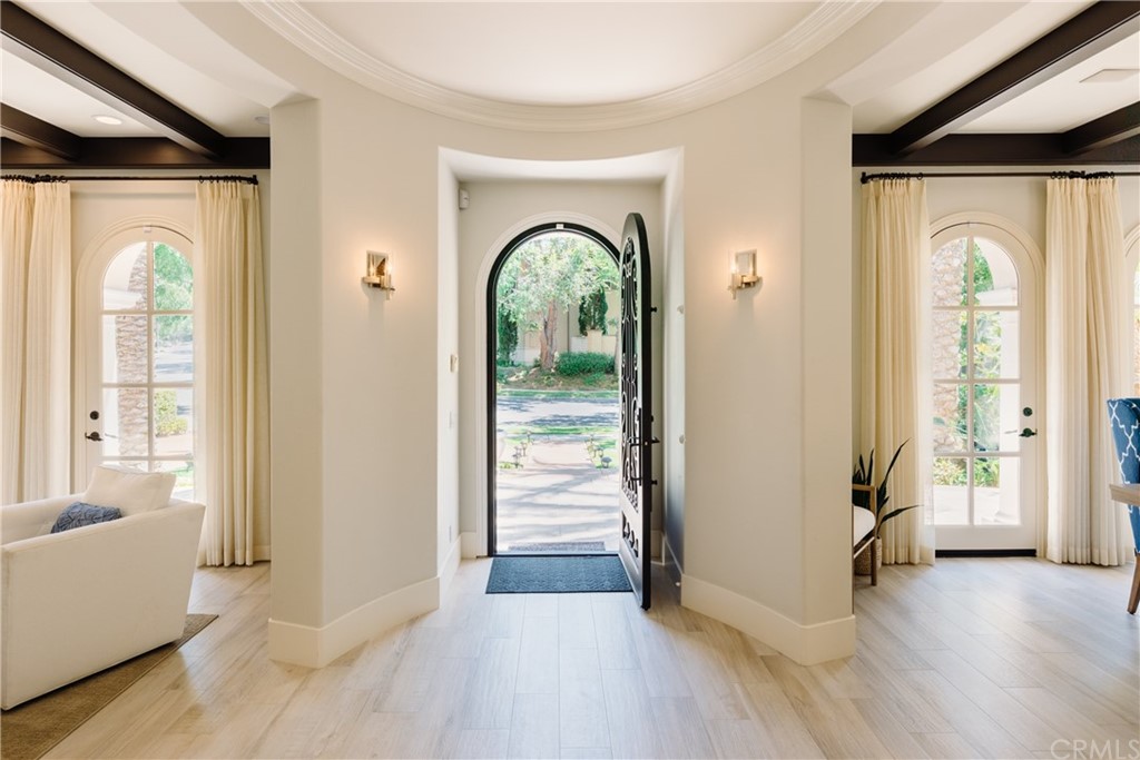 26 Seabluff Newport Beach, CA 92660 - Photo 3 of 59 a view of a livingroom with wooden floor and a fireplace