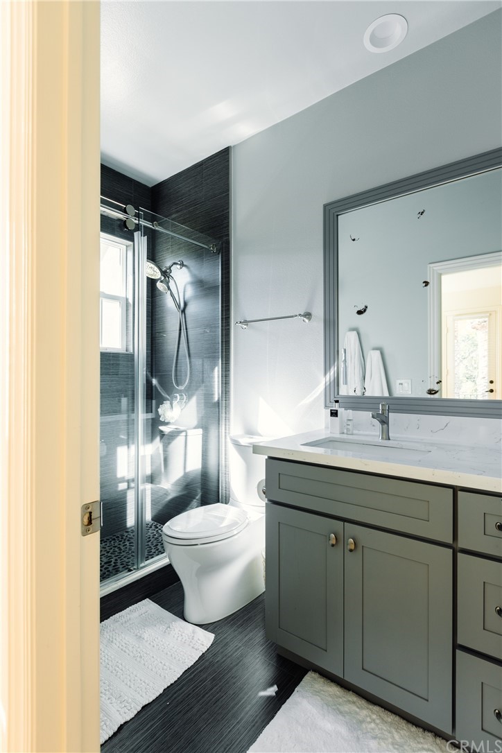 26 Seabluff Newport Beach, CA 92660 - Photo 37 of 59 a bathroom with a double vanity sink and mirror