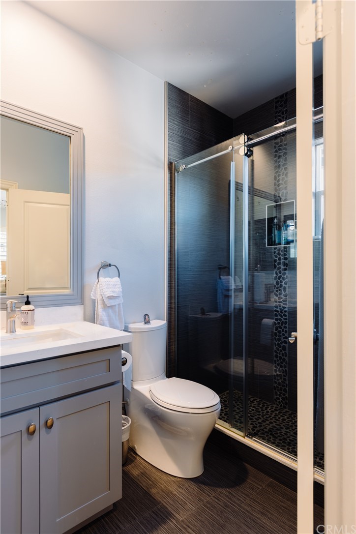 26 Seabluff Newport Beach, CA 92660 - Photo 40 of 59 a bathroom with a sink a toilet and shower