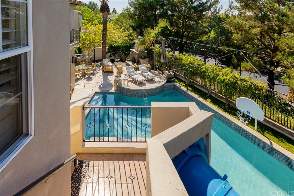 26 Seabluff Newport Beach, CA 92660 - Photo 48 of 59 a view of a balcony with chairs and a potted plant