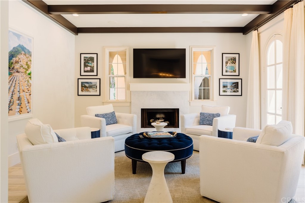 26 Seabluff Newport Beach, CA 92660 - Photo 5 of 59 a living room with furniture fireplace and window