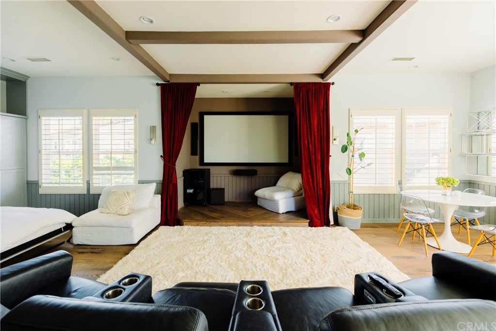 26 Seabluff Newport Beach, CA 92660 - Photo 51 of 59 a living room with furniture and a flat screen tv