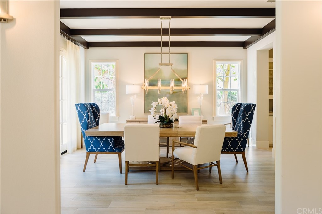 26 Seabluff Newport Beach, CA 92660 - Photo 7 of 59 a dining room with furniture and wooden floor