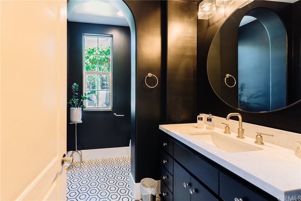26 Seabluff Newport Beach, CA 92660 - Photo 10 of 59 a bathroom with a sink and a mirror