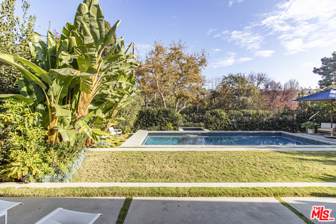535 East Channel Road Santa Monica, CA 90402 - Photo 15 of 41 a view of a swimming pool with a yard