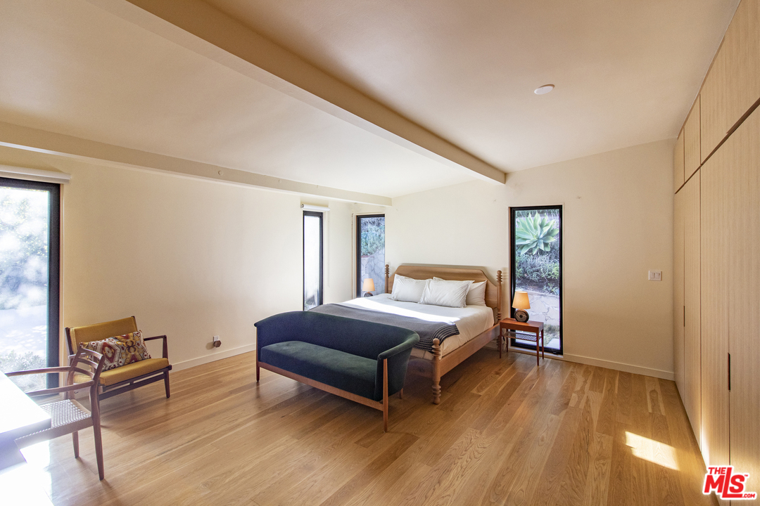 535 East Channel Road Santa Monica, CA 90402 - Photo 22 of 41 a bedroom with a bed and a chair