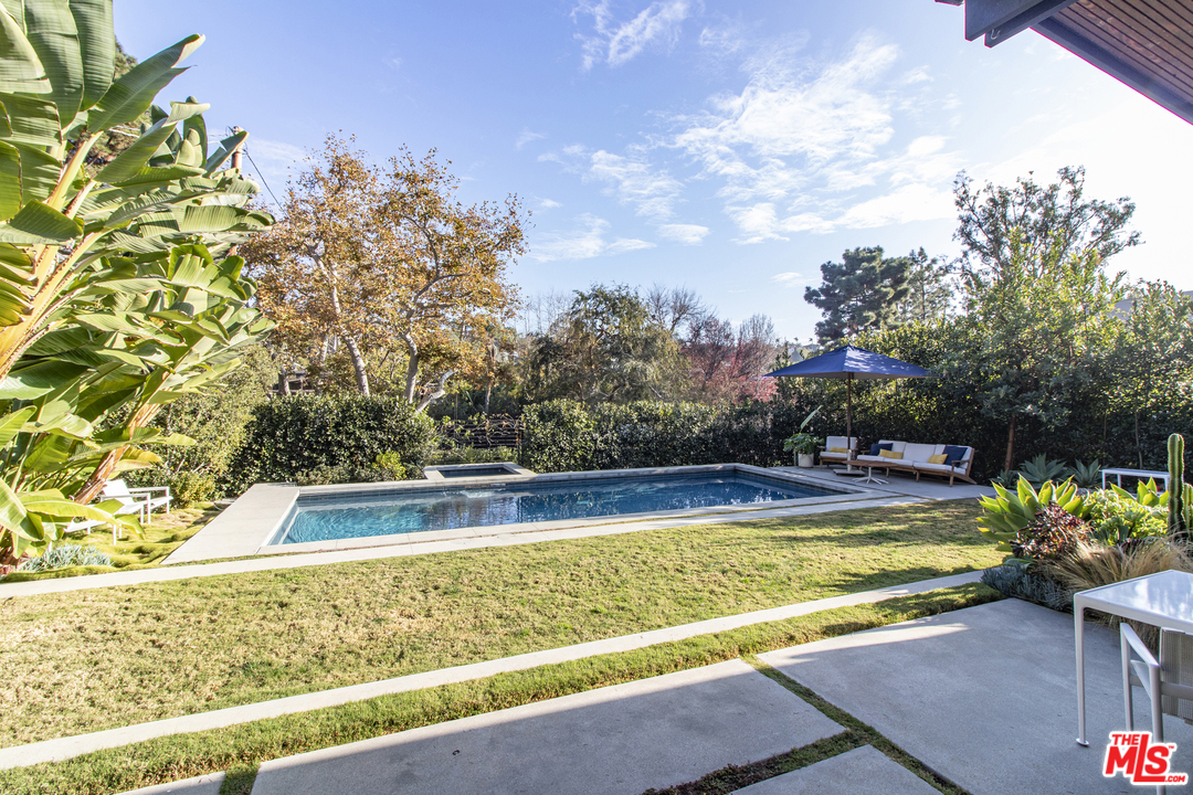 535 East Channel Road Santa Monica, CA 90402 - Photo 36 of 41 a view of a swimming pool with a yard
