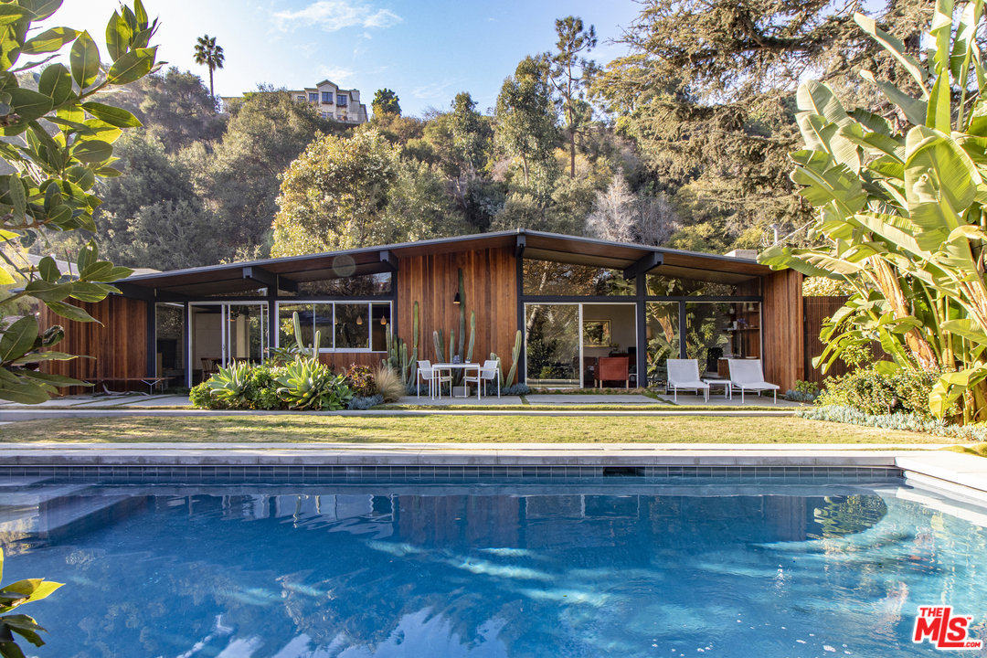 535 East Channel Road Santa Monica, CA 90402 - Photo 37 of 41 a view of a house with pool and chairs