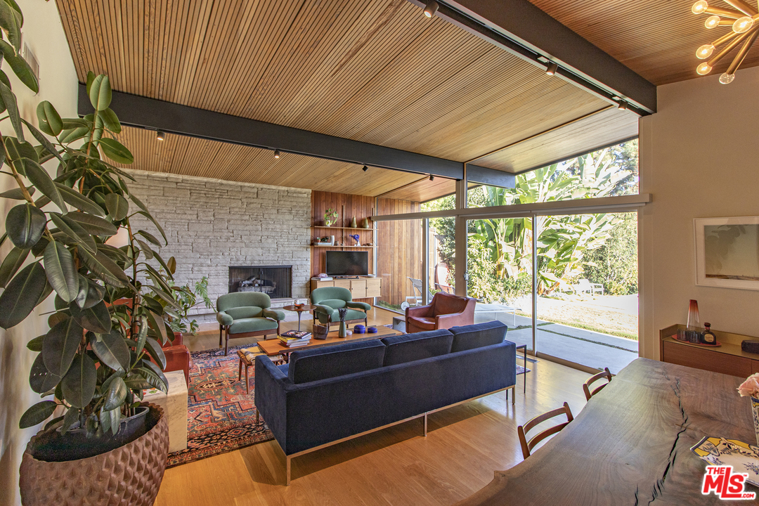 535 East Channel Road Santa Monica, CA 90402 - Photo 40 of 41 a living room with fireplace furniture and a large window