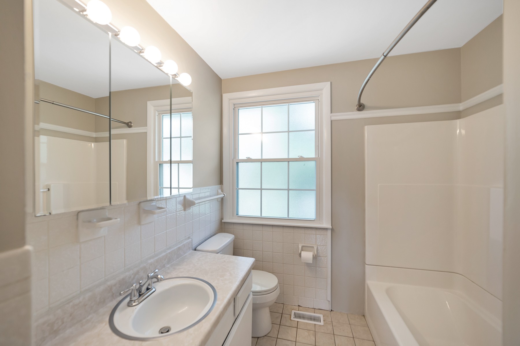 7880 Saundersville Road Mount Juliet, TN 37122 - Photo 13 of 24 a bathroom with a granite countertop sink toilet and shower