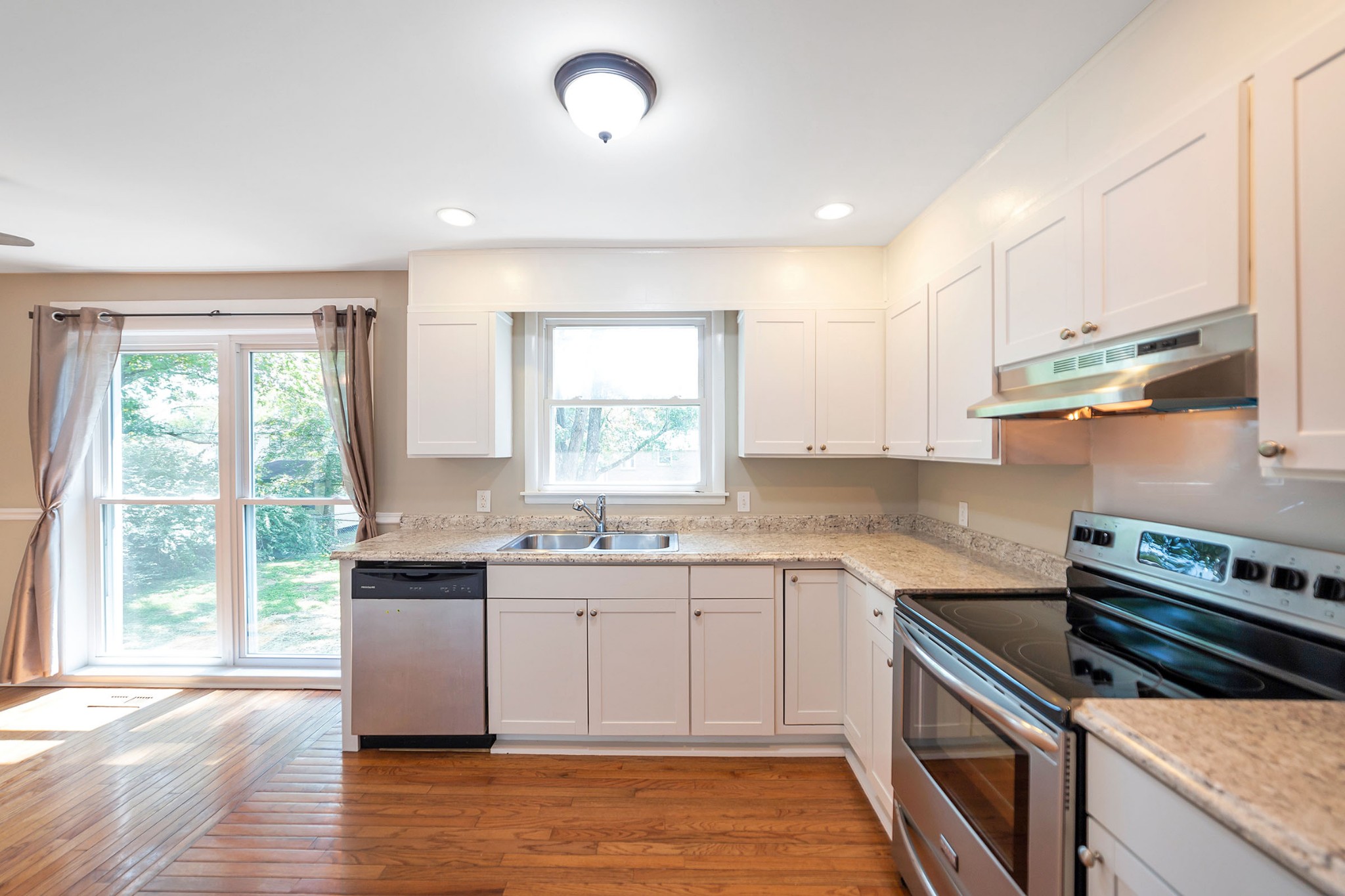 7880 Saundersville Road Mount Juliet, TN 37122 - Photo 2 of 24 a kitchen with a sink stove and cabinets