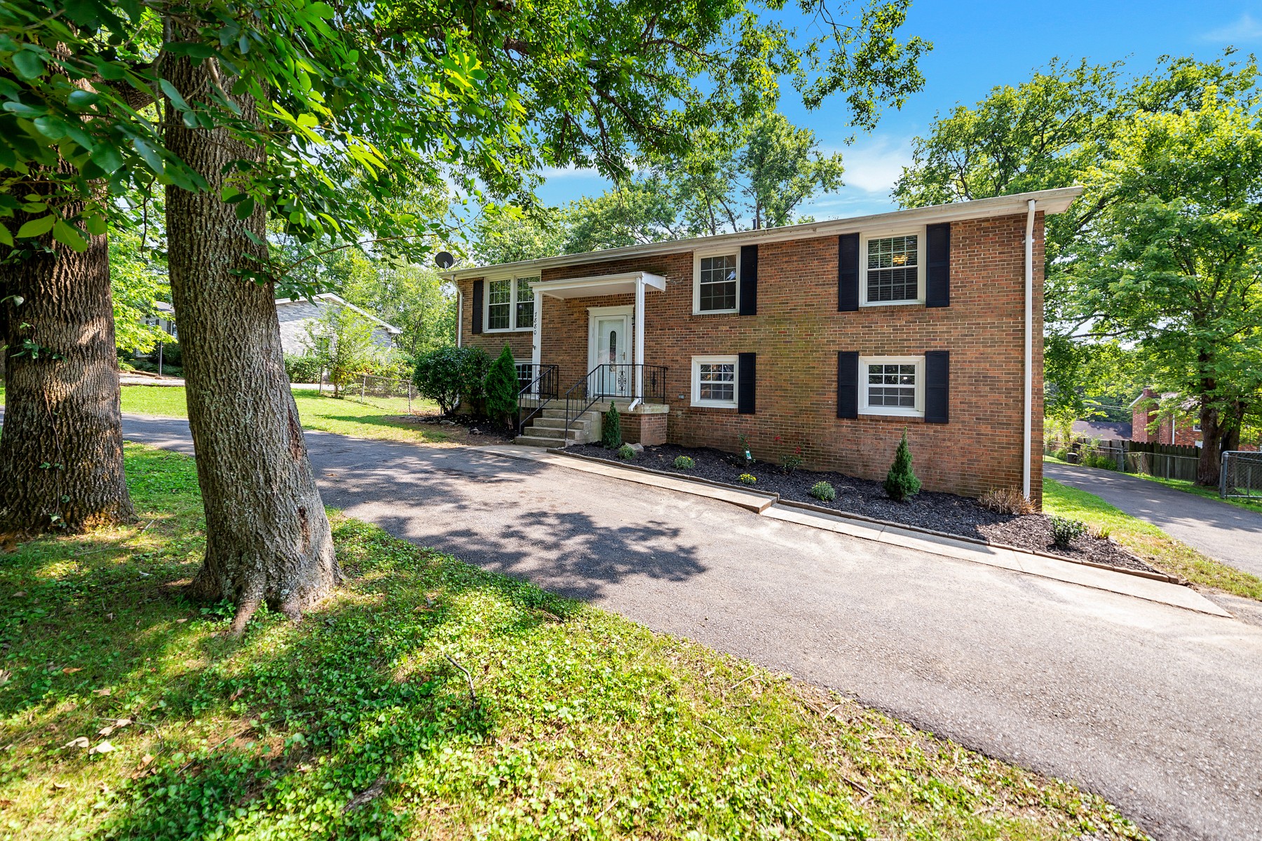 7880 Saundersville Road Mount Juliet, TN 37122 - Photo 21 of 24 front view of a house with a yard